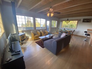 Living/dining room that extends to a gorgeous oversized outdoor deck with views. 