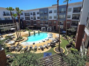 Dive into luxury in our resort-style pool! Surrounded by lush landscaping and equipped with sparkling waters, our pool offers the ultimate retreat for relaxation and rejuvenation. 