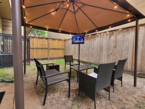 Step into our outdoor haven, where relaxation and entertainment come together in perfect harmony. This private outside area is a true oasis, meticulously designed to provide you with an exceptional outdoor living experience