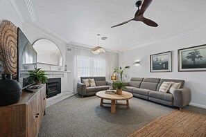 Living Area with Fireplace + Smart TV