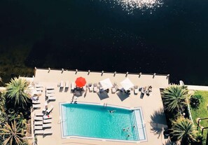 Take a refreshing dip in the scenic onsite pool overlooking the water
