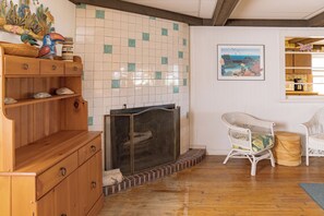 The grilling implements are in the hutch to the left.  There are some toys in the basket between the chairs. 
Please, no fires in the fireplace.
