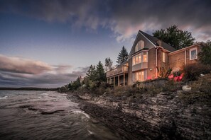 Cliffside waterfront property with stunning views of Georgian Bay, perched right by the water for unparalleled access to nature and tranquility. The perfect retreat for soaking in Bruce Peninsula’s famous sunsets and enjoying the peaceful ambiance of Lake Huron's rugged shoreline.
