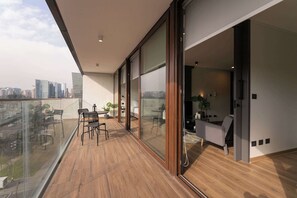 Enjoy breathtaking city views from your private balcony, perfect for morning coffee or evening relaxation.