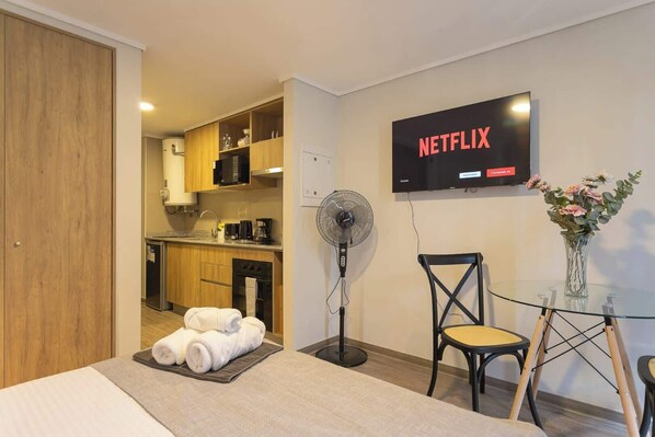 Cozy studio with modern amenities, including a kitchenette and Netflix for your entertainment. Perfect for a relaxing stay.