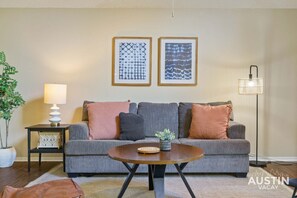 Open living room with sleeper sofa and smart tv
