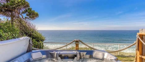 Picture yourself unwinding in this bubbly hot tub with breathtaking ocean views! Pure relaxation awaits.