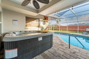 Hot tub overlooking pool.