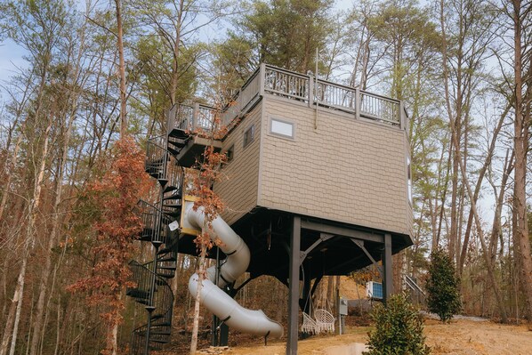 Treehouse with tunnel slide