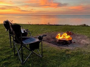 Fireside warm overlooking Lake Erie, enjoy our oversized seating with guests.