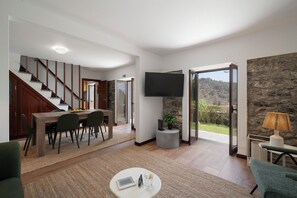 Livingroom with a TV , dinning room and stairs