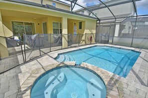 View of pool and spa showing safety fence
