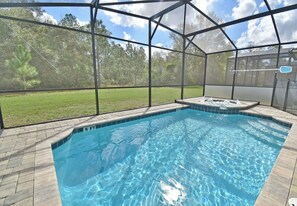View of pool and spa showing privacy screen