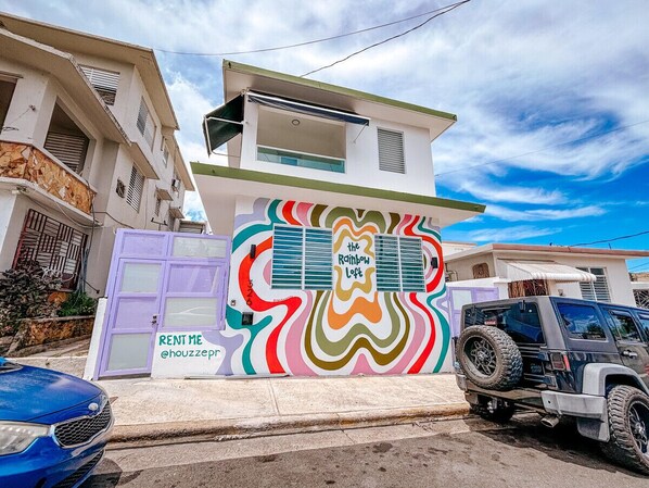 A stunning exterior with colorful details that reflect the vibrant interior.