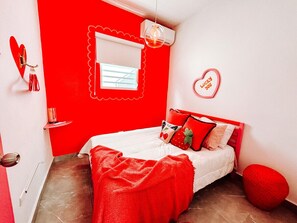 A tranquil bedroom designed for ultimate relaxation with pops of color.