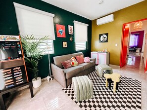 Relax in style in this spacious, rainbow-inspired living area.