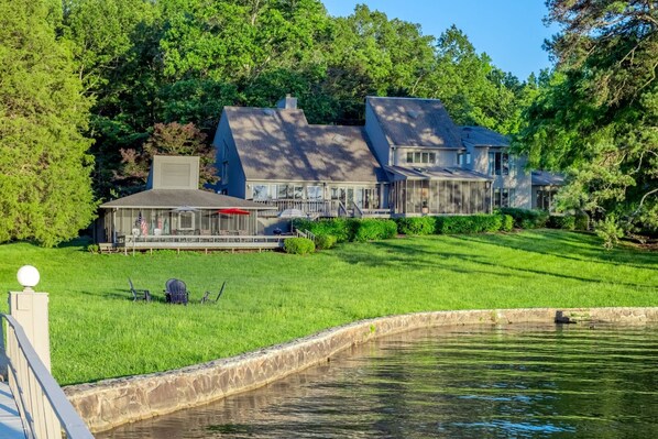 View of the expansive property and yard from the boat dock