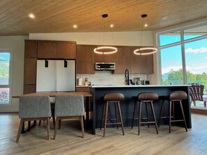 Spacious cooks kitchen with seating for 7. There is an additional high top dining/games table and chairs to come!