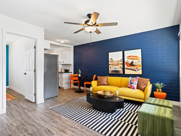 Relax in a bright and inviting living room, complete with cozy seating and a Smart TV, the perfect spot for unwinding after a day of exploration!