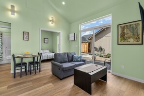 Sliding Glass Door opens to patio and shared fenced yard area