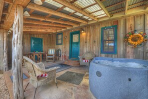 Relax for the evening with a glass of wine while soaking in the bubbling hot tub