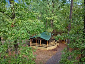 Experience the peaceful charm of this quaint cabin, complete with a wrap-around deck perfect for enjoying morning coffee or evening stargazing.