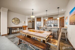 Enjoy your culinary creations at the large dining table, which seats up to 8 guests, plus 4 additional counter stools for casual dining.