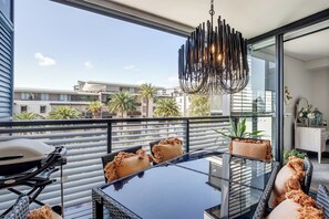 Step out onto the spacious balcony, furnished with a BBQ and seating for six. Overlooking the pool area, this outdoor oasis is perfect for alfresco dining, sunset drinks, or simply enjoying the fresh air.