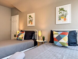 As you settle into the twin beds, you’re surrounded by a calming ambiance that promises a peaceful night’s sleep.