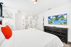 Experience ultimate comfort with a plush king-sized bed, modern furniture, and serene ambient lighting.