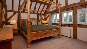 Carved four poster beds add elegance