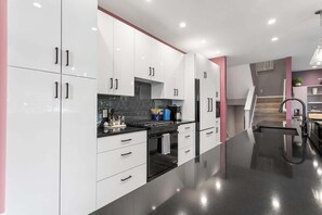 Fully equipped Kitchen filled with all of your cooking needs. Tons of platters, flatware, dishes, appliances, you name it!
