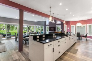 Expansive Kitchen Island creates a great atmosphere to enjoy food with family and friends. 