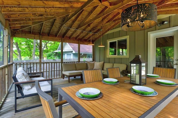 Enjoy the outdoors rain or shine on this spacious three season sunroom.