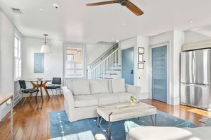 Generous open plan living room, dining area, and kitchen