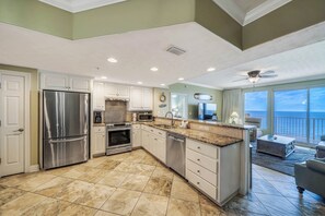 The fully equipped kitchen features granite countertops, stainless-steel appliances, and has everything you need to prepare meals for family & friends.