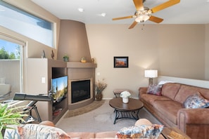 Vaulted ceilings and a gas fireplace create a spacious, but cozy living space.