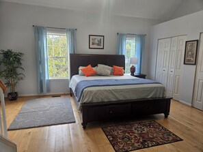 Master bedroom with a king bed 