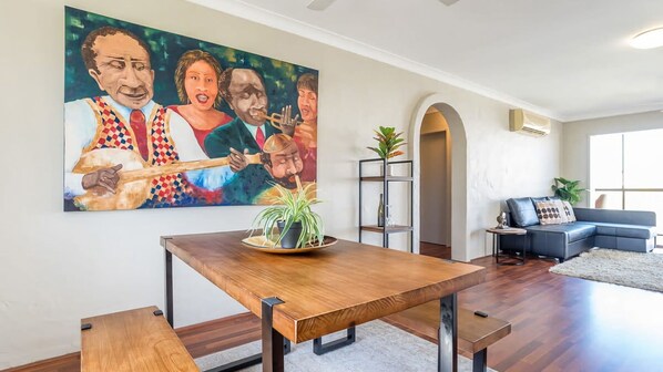 Connected to the living area and kitchen, you'll find a dining area which accommodates 4 guests