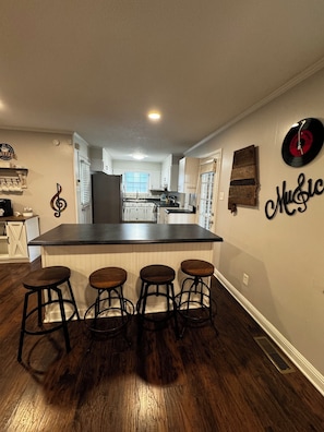 Kitchen with extra sitting area, fully stocked kitchen with dishwasher.