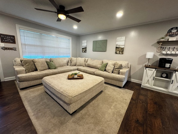 Large living room with 50in smart tv and coffee bar.