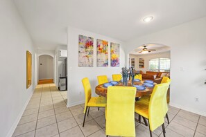 Celebrate in our cheerful dining room with solid wood table that accommodates 8.