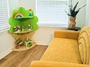 A play area just for the little ones includes a 4'x3' sequin sensory wall.