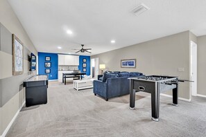 A fun space with games, comfy seating, and entertainment options for all ages