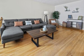 Cozy living room with 65” Smart TV