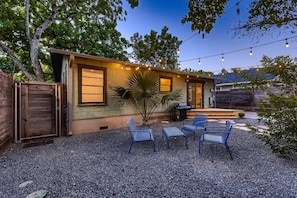 Vibrant backyard with a colorful mix of plants and flowers, creating a bright and cheerful atmosphere.