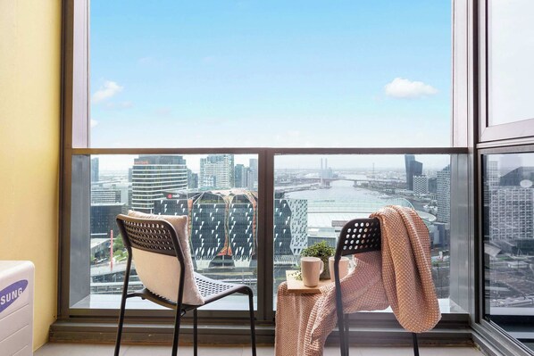 Enjoy city views from the balcony. (chairs on balcony are from the dining area)