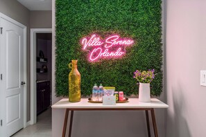 A minimalist table that contrasts beautifully against the vibrant neon lighting.