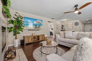 Spacious Living Room with Large Screen Smart TV