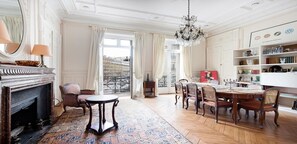 dining table for 6 people, coffee table, 2 armchairs, decorative fireplace,